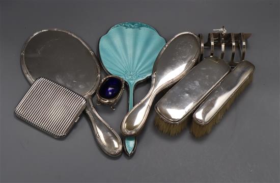 Mixed silver and continental white metal items including enamelled hand mirror, cigarette case, brush set, toast rack.